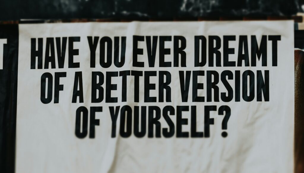 A weathered poster reading "Have you ever dreamt of a better version of yourself?" — a question that connects to setting boundaries as a path to self-improvement.